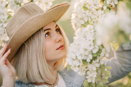 Beautiful happy blonde in the Park on a warm summer day.