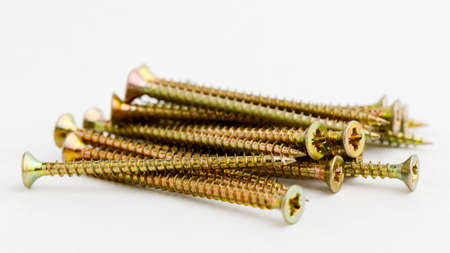Pile of brass metal screws. Instruments conceptの写真素材