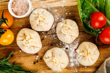 Cooking, cooking homemade ravioli, dumplings or meat dumplings on a wooden table. The view from the top.の写真素材