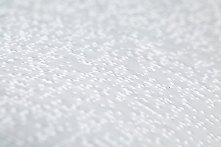Page of the book with Braille text, close-up. Concept of education for blind people.の写真素材