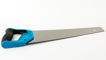 saw on wood, isolated on a white background.の写真素材