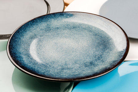 A set of clean dishes and cups. Handmade ceramics, catering, restaurant, healthy food. Space for text.の写真素材