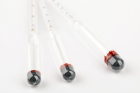 device for measuring the degree of alcohol in a distillery on a white background.
