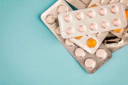 View of tablets in a blister, on a blue background