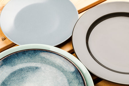 A set of clean dishes and cups. Handmade ceramics, catering, restaurant, healthy food. Space for...