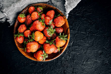 Red strawberries on a dark boardの写真素材
