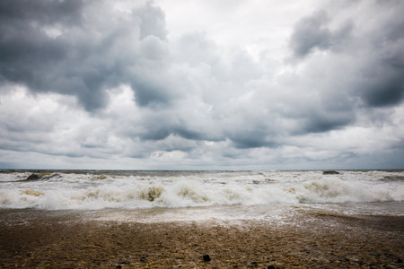 Storm clouds over the sea. Dramatic sky and giant waves.の写真素材