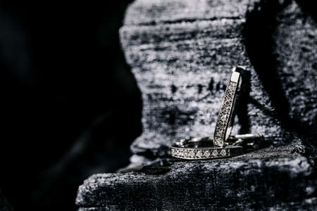 A subject shot of Diamond earrings on a black charcoal background. White gold.の写真素材