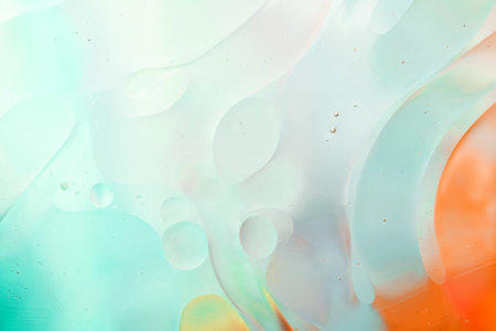 Close-up of the movement of oil droplets on the water surface. Colorful abstract macro background of...
