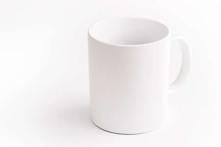 White ceramic cup on white backgroundの写真素材