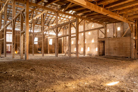 Old Barn Wooden Beams of Sunlight Interior Dusty Farm Emptyの写真素材