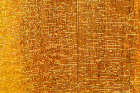 old wood board closer texture background with cracked lacquerの写真素材