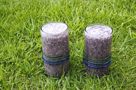 wo healthy drinks, blueberry smoothies with coconut milk servedの写真素材