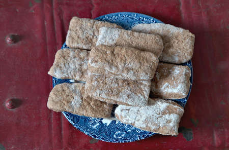 A pile of pita breads on blue plate.の写真素材