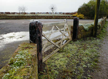 Old vintage wooden gate to the farm in Cheshire (UK) during frostの写真素材