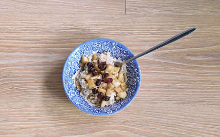 Healthy brown rice pudding, dessert with fruits on topの写真素材