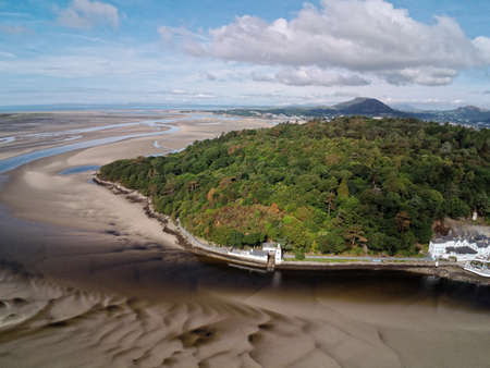 Aerial view, Drone panorama of lighthouse on cape in Portmeirion, Snowdonia mountains in Walesの写真素材