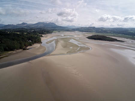 Aerial view, Drone panorama of Grifftan island on low tide sea in Snowdonia mountains in Walesの写真素材