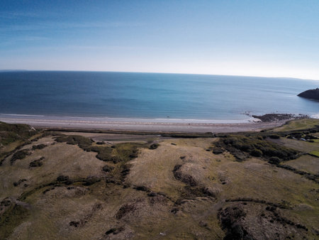 Aerial view, Drone panorama over meadow, shore and sea in Wales