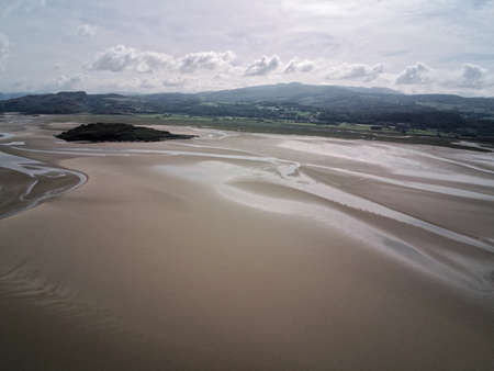 Aerial view, Drone panorama of Grifftan island on low tide sea in Snowdonia mountains in Walesの写真素材
