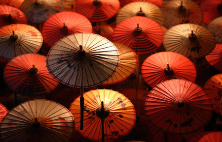 Colourful chinese umbrellas with patterns, created using generative ai technology. Protection, weather, decoration and chinese culture concept digitally generated image.の素材