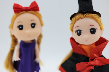 Halloween theme: a pair of witch dolls isolated on white backgroundの写真素材