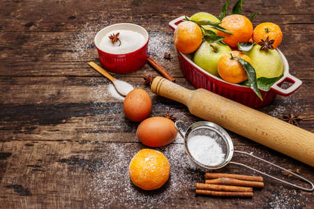 Christmas baking background. Raw ingredients for cooking xmas baking. Vintage wooden table, copy spaceの写真素材