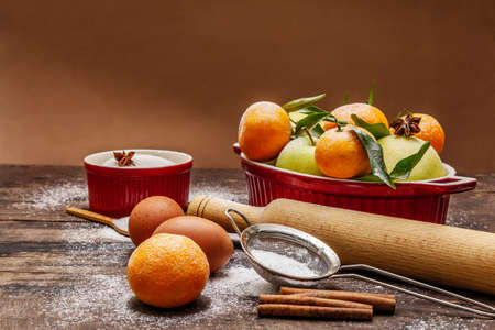 Christmas baking background. Raw ingredients for cooking xmas baking. Vintage wooden table, copy spaceの写真素材