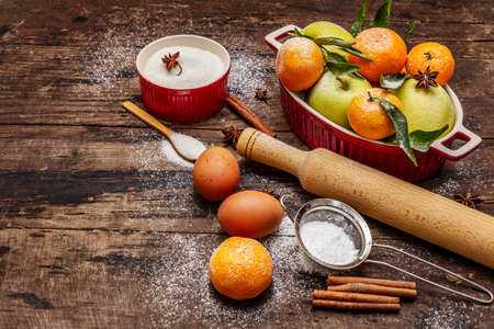 Christmas baking background. Raw ingredients for cooking xmas baking. Vintage wooden table, copy spaceの写真素材