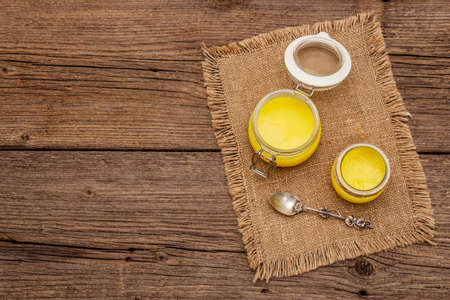 Pure or desi ghee (ghi), clarified melted butter. Healthy fats bulletproof diet concept or paleo...