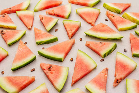 Fresh juicy slices of watermelon. Sweet summer dessert healthy eating concept. Stone concrete backgroundの写真素材