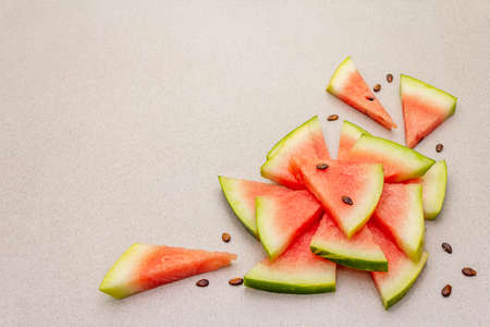 Fresh juicy slices of watermelon. Sweet summer dessert healthy eating concept. Stone concrete background, copy spaceの写真素材