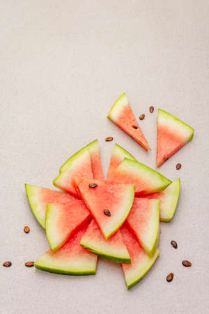 Fresh juicy slices of watermelon. Sweet summer dessert healthy eating concept. Stone concrete background, copy spaceの写真素材