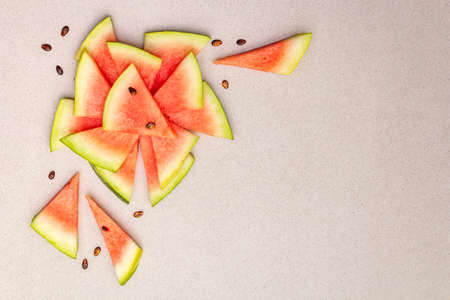 Fresh juicy slices of watermelon. Sweet summer dessert healthy eating concept. Stone concrete background, copy space, top viewの写真素材