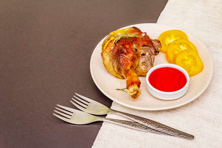Crusty roasted duck leg. Traditional French food confit preparation. Served with cranberry sauce,...