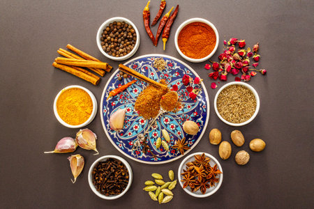 Ras el Hanout, exotic luxury spice. Ingredients for preparation oriental spice mix in ceramic bowls....