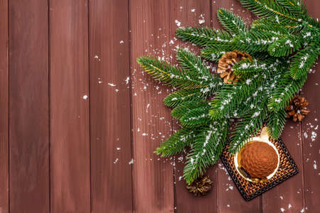Festive dessert in the shape of a Christmas fir cone. New Year sweet treat concept. Wooden boards background, copy space, top viewの写真素材