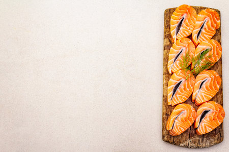 Slices of fresh salmon fish in steak shape. Raw ingredient for cooking healthy seafood. Concept...