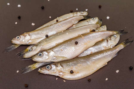 Raw sea fish smelt, sardines, anchovies, capelin with the scent of fresh cucumber ready for cooking....