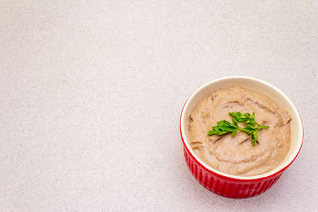 Chicken liver pate with butter and fresh parsley. Concept of traditional french food. On stone background, copy spaceの写真素材