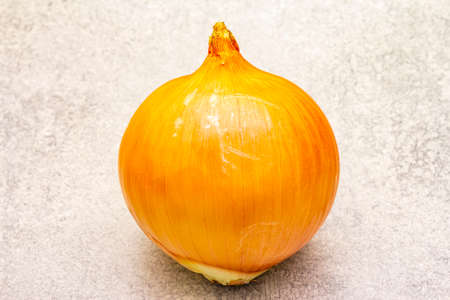Giant onion bulbs on a stone background. Food cooking background, close upの写真素材