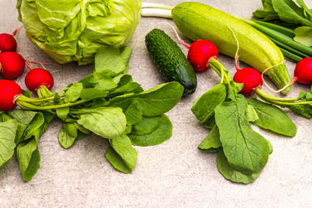 Assortment fresh green organic vegetables. Food cooking stone background. Healthy vegetarian (vegan) eating concept, close upの写真素材