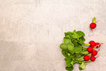 Fresh organic radish. Food cooking stone background. Healthy vegetarian (vegan) eating concept, top view, copy space, flat layの写真素材