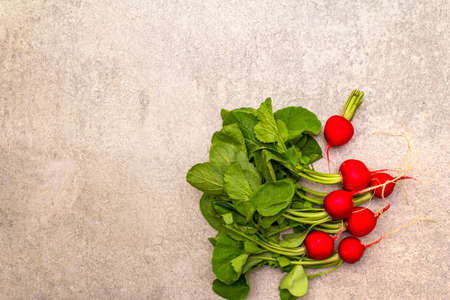 Fresh organic radish. Food cooking stone background. Healthy vegetarian (vegan) eating concept, top view, copy space, flat layの写真素材