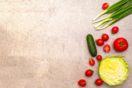 Assortment fresh organic vegetables. Food cooking stone background. Healthy vegetarian (vegan) eating concept, top view, flat lay, copy spaceの写真素材