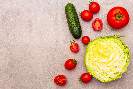 Assortment fresh organic vegetables. Food cooking stone background. Healthy vegetarian (vegan) eating concept, top view, flat lay, close up, copy spaceの写真素材