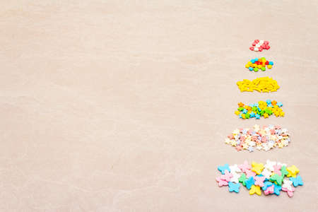 Assortment of various Easter decorative sugar sprinkles, Food background. On stone backgroundの写真素材