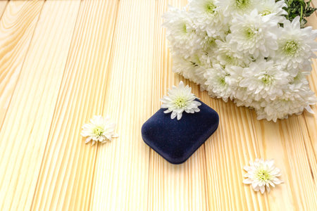 Romantic gift concept. Valentines day or 8th march or love holiday. Present case and flowers. Table...