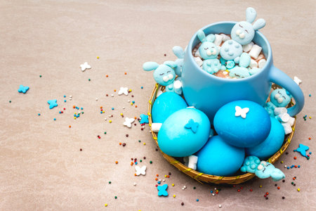 Easter kids hot sweet chocolate or cocoa with funny marshmallow bunny rabbits and easter eggs. On...