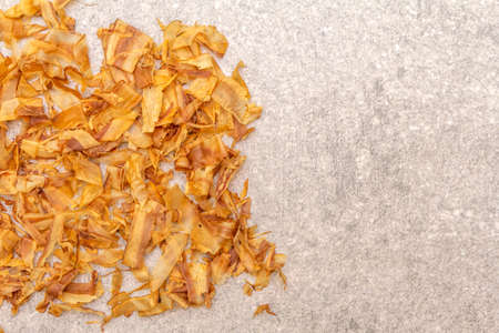 Tuna shaving katsuobushi, bonito flakes, ingredient of japanese soup dashi. On stone background, top view, close up.の写真素材